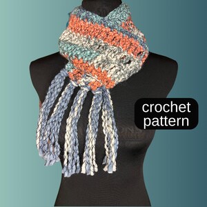 May include: A crocheted scarf with a striped pattern in shades of blue, white, and orange. The scarf has long fringe tassels and is displayed on a black mannequin. The text "crochet pattern" is visible in the image.