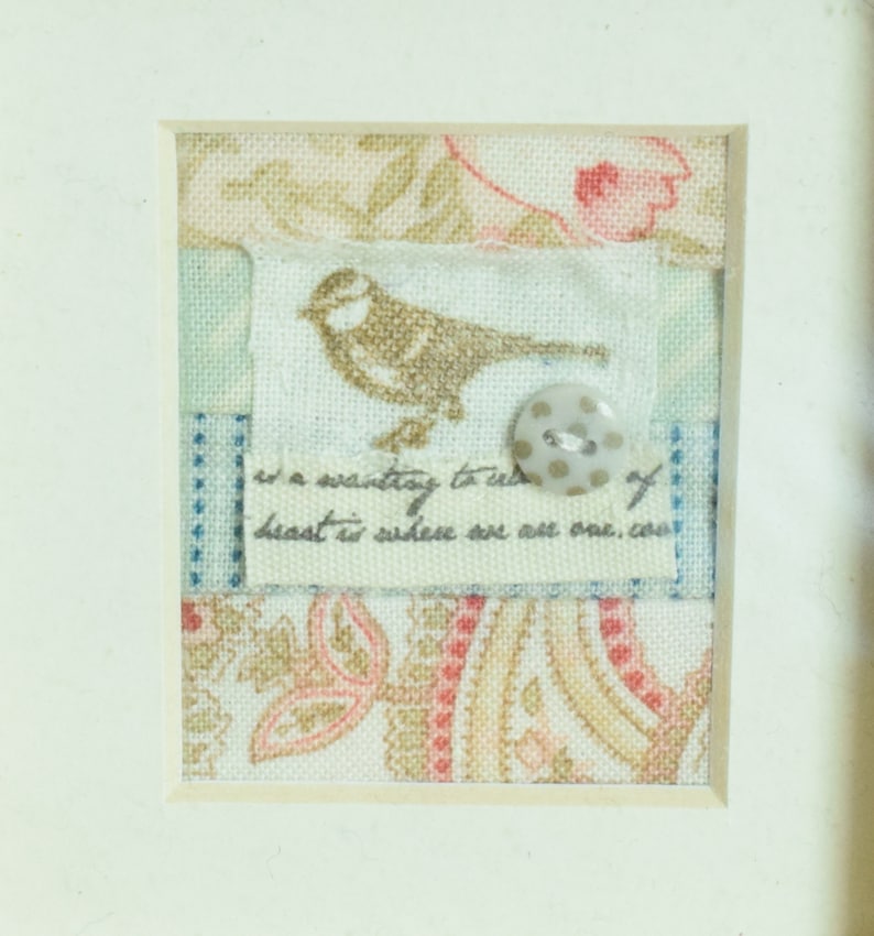 and finished with a tiny spotted button Small vintage style framed fabric collage featuring a tiny bird motif