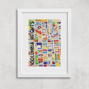 May include: A colorful illustrated map of Columbia Heights, a neighborhood in Washington, D.C. The map is framed in a white frame.