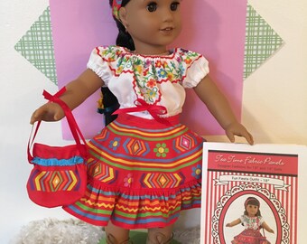 May include: A doll wearing a colorful Mexican fiesta outfit, including a red skirt, white blouse with floral embroidery, and a matching headband. The doll holds a red purse and wears brown boots. A printed panel is visible.