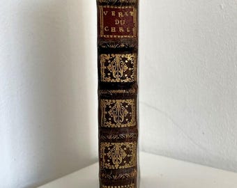 1700 Hermoso libro francés sobre el cristianismo, encuadernado en piel, decoración dorada, guardas jaspeadas, excelente estado.