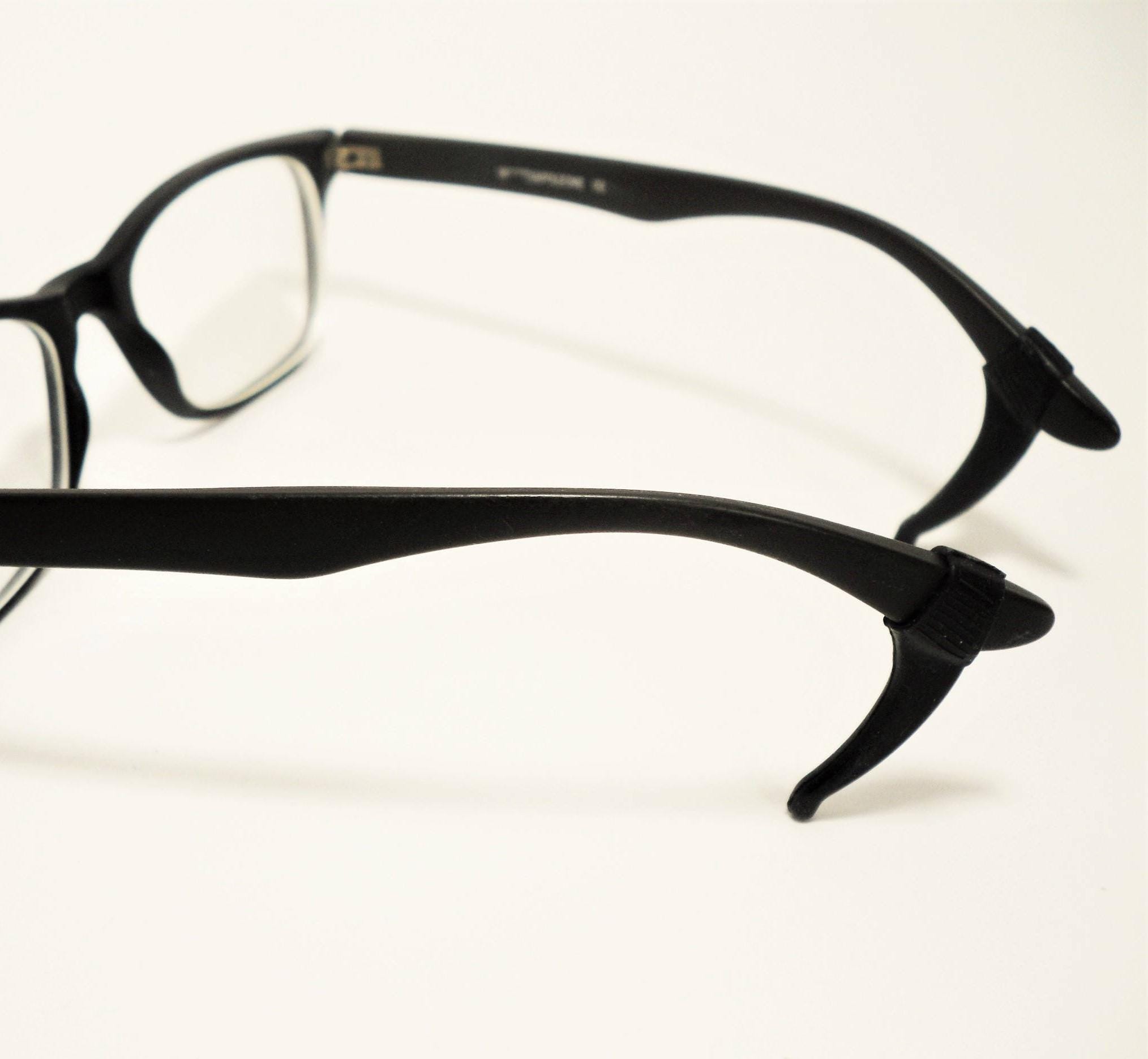 Eyeglass arm grips top