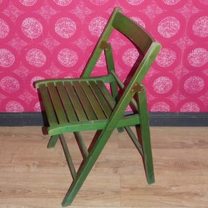 A vintage folding chair made of GREEN wood, beautifully designed and practical, from the 70s.