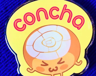 May include: A yellow and orange cartoon character with a spiral shell on its head. The character has a happy expression and is holding a gold star keychain. The keychain has the word "concha" written in red on it.