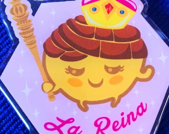 May include: A pink and yellow cartoon character with a brown crown and a golden scepter. The character is wearing a pink dress and has a pink background. The text "La Reina" is written in pink on the bottom of the image.