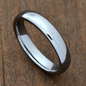 May include: A simple, silver-toned wedding band with a smooth, polished finish.