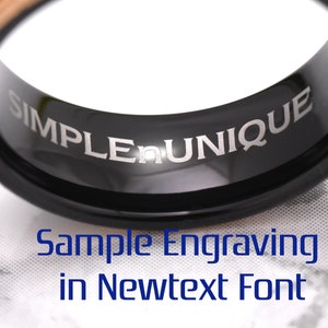 May include: A black and rose gold tungsten carbide ring with the words "SIMPLE UNIQUE" engraved on the inside of the band. Sample Engraving in Newtext Font.