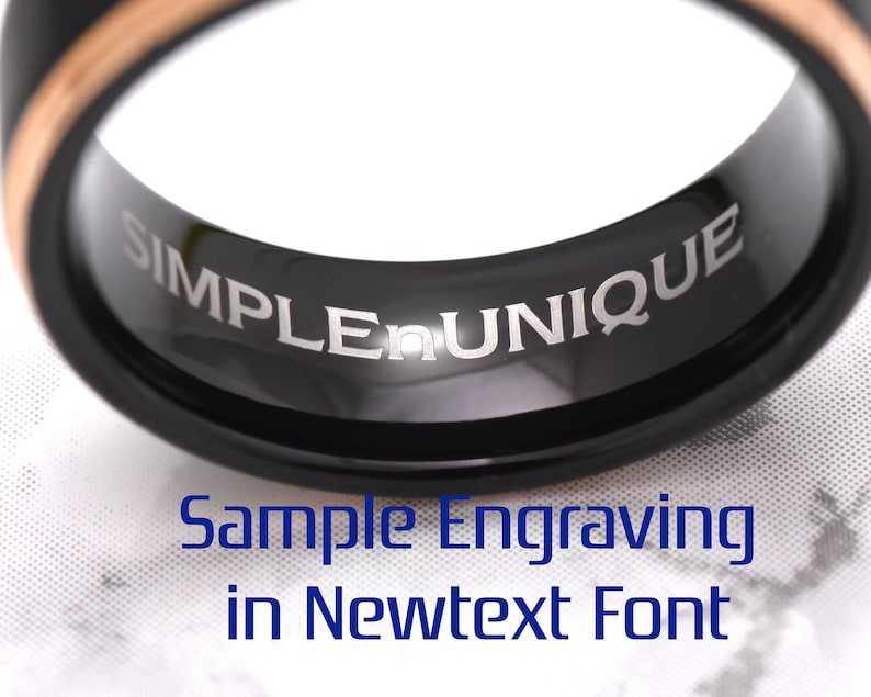 May include: A black tungsten ring with a rose gold inlay and the words "SIMPLE UNIQUE" engraved on the inside of the band. Sample engraving in Newtext font.
