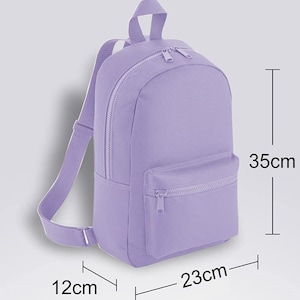 May include: A lavender-colored backpack with a zippered front pocket. The backpack measures 12 inches wide, 23 inches long, and 35 inches tall.