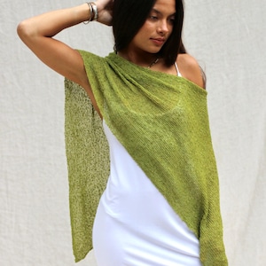 May include: A white ceramic mug with a black handle and the text "But First, Coffee" in a black, bold font. The mug is sitting on a white surface. The mug is approximately 4 inches tall.