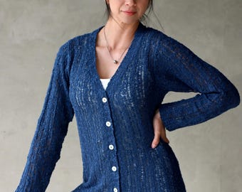 Cardigan Knit Button Up Cardigan Shell buttons Flattering silhouette Textural Weave with Vertical lines through out. Perfect go to sweater.