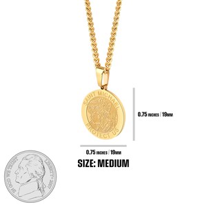 May include: Gold chain necklace with a round pendant featuring the words "Saint Michael Protect Us". The pendant is 0.75 inches in diameter.