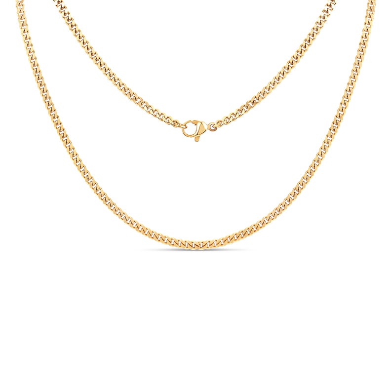 May include: A gold chain necklace with a lobster clasp closure. The chain is made of a curb link pattern.