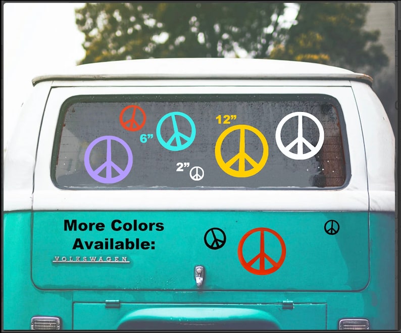 May include: A blue Volkswagen van with a rear window displaying various peace sign decals in different colors and sizes, including 2 inch, 6 inch, and 12 inch. The text "More Colors Available" is displayed on the van's body.