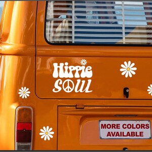 May include: Orange vintage van with a white "Hippie Soul" decal with a peace sign. The van has white daisy decals on the back. The text "More Colors Available" is on a red and white license plate.