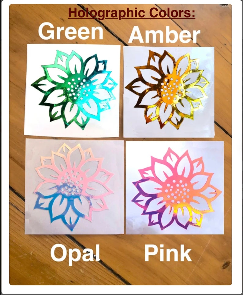 May include: Four holographic sunflower decals in green, amber, opal, and pink. The decals are on white paper with the color names printed below each decal.