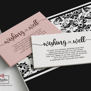 May include: Two pink and white cards with the text "wishing well" and a heart symbol. The text on the cards reads "To save you looking, shopping or buying, here's an idea we hope you like trying. A honeymoon adventure is what we're after, that will bring us joy and lots of laughter. So if you wish to participate, a monetary gift would be just great."