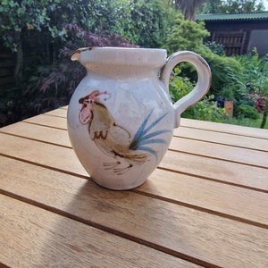 Vintage jug or pitcher, by Grayshott pottery, with cockerell design.