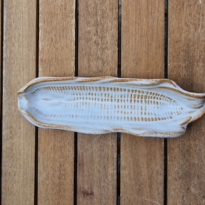 Vintage stoneware plate with corn on the cob design