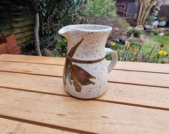 Vintage stoneware jug, with attractive mottled design and abstract design on the front.