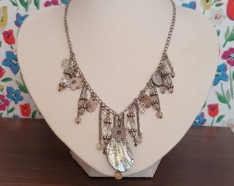 Pretty tassel necklace made from a silver tone chain with a mixture of beads.