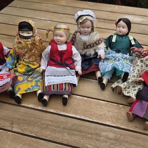 Vintage Dolls of the World, individually available, porcelain head and arms, small in size.
