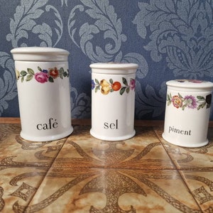 Vintage ceramic coffee, salt and pepper/chilli canisters by Porcelaine de Paris in the 4 seasons design.