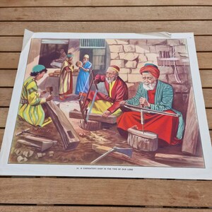 Impresión o póster vintage 'Un taller de carpintero en el tiempo de nuestro Señor' ilustrado originalmente por John L Baker.