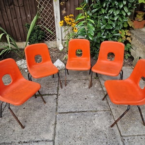 Vintage infant chair, orange in colour. Individually available.