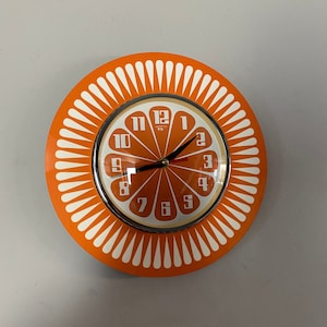 Silent 1970's style Sunburst Orange Wall Clock in Orange & White with a Funky Orange Segment Face from Royale