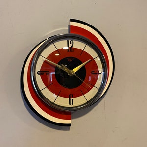 Colour Etched Spinning Meteor Formica Caravan Wall Clock from Royale - Midcentury Atomic Jetsons Retro style in Tomato Red Cream & Black.