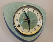Handmade Asymmetric Queens Gambit style Wall Clock in Sage Green with Starburst Dial from Royale - Midcentury French Atomic Retro.
