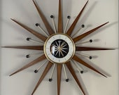 27 inch Hand Made Mid Century style Majestic Starburst Clock by Royale Medium Teak Rays, Black Goldtone