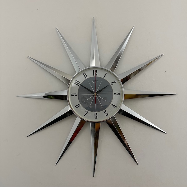British Made 24 inch Mid Century style Starburst Clock by Royale 12 Nickel Chrome Plated Metal Rays with a 1950's Dove Grey Face