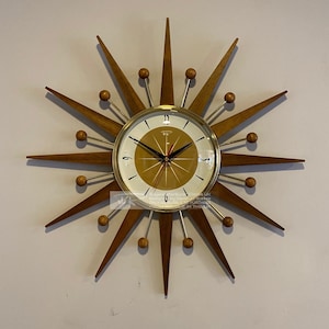 19 inch Hand Made Mid Century style Majestic Starburst Clock by Royale Medium Waxed Teak Rays Burnt Gold 1950s Face & Goldtone Frame