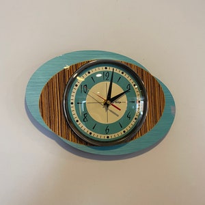 Colour Etched Formica Wall Clock in Aqua Blue Faux Walnut & Zebra Wood from Royale - Midcentury Atomic Jetsons Retro style.