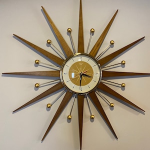 27 inch Hand Made Mid Century style Goldtone Starburst Clock by Royale Medium Teakwood Rays, Burnt Gold & White 1950's Face