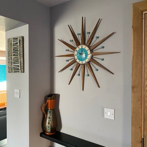 Top Selling Starburst Wall Clock by Royale Mid Century Modern style Chrome Silent Medium Teak Rays Turquoise Face Atomic Balls British Made image 6