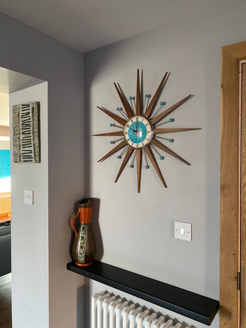 Top Selling Starburst Wall Clock by Royale Mid Century Modern style Chrome Silent Medium Teak Rays Turquoise Face Atomic Balls British Made image 6