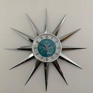 British Made 24 inch Mid Century style Starburst Clock by Royale 12 Nickel Chrome Plated Metal Rays with a 1950&#39;s New Turquoise Face