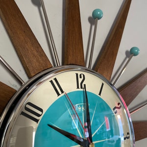 Top Selling Starburst Wall Clock by Royale Mid Century Modern style Chrome Silent Medium Teak Rays Turquoise Face Atomic Balls British Made image 4