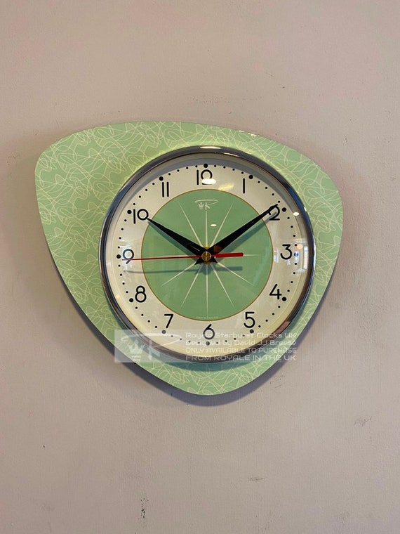 Handmade jadeite green starburst wall clock with that perfect atomic-age sputnik silhouette — a genuine statement piece, not a mass-produced knockoff.