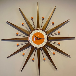 27 inch Handmade Mid Century Modern style Starburst Clock by Royale Medium Waxed Teakwood Rays Tangerine 1950s Face & Copper Plated frame.
