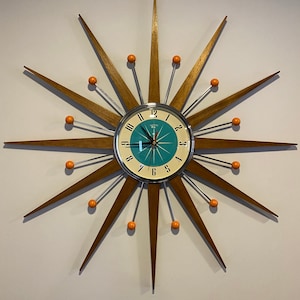 27 inch Hand Made Mid Century style Starburst Clock by Royale - Welby style in Chrome with Medium Teak Rays & with a Turquoise 1950's Dial