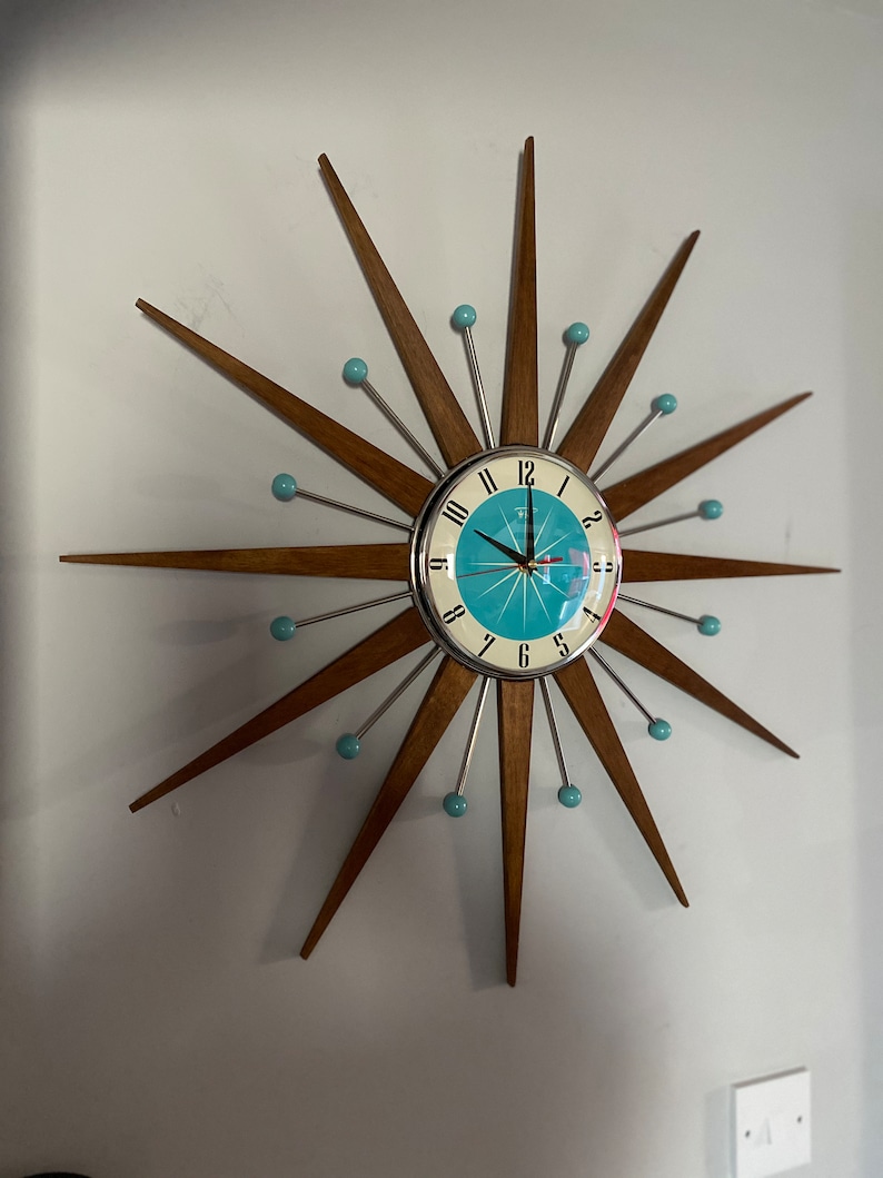 Top Selling Starburst Wall Clock by Royale Mid Century Modern style Chrome Silent Medium Teak Rays Turquoise Face Atomic Balls British Made image 2