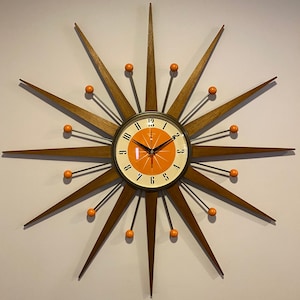 27 inch Hand Made Mid Century style Starburst Clock by Royale Welby style in Antique Bronze with Medium Teak Rays & with Tangerine Dial