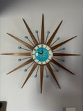 Top Selling Starburst Wall Clock by Royale Mid Century Modern style Chrome Silent Medium Teak Rays Turquoise Face Atomic Balls British Made