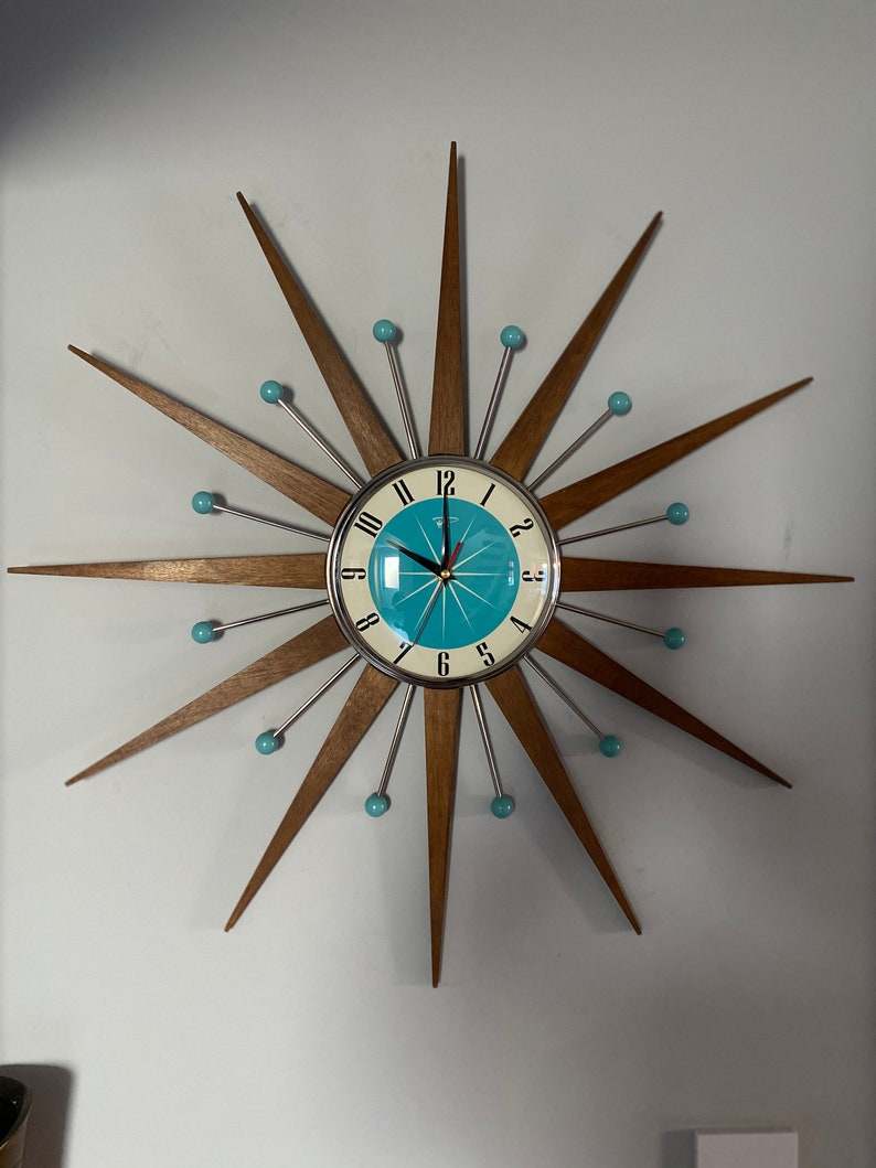 Top Selling Starburst Wall Clock by Royale Mid Century Modern style Chrome Silent Medium Teak Rays Turquoise Face Atomic Balls British Made image 1