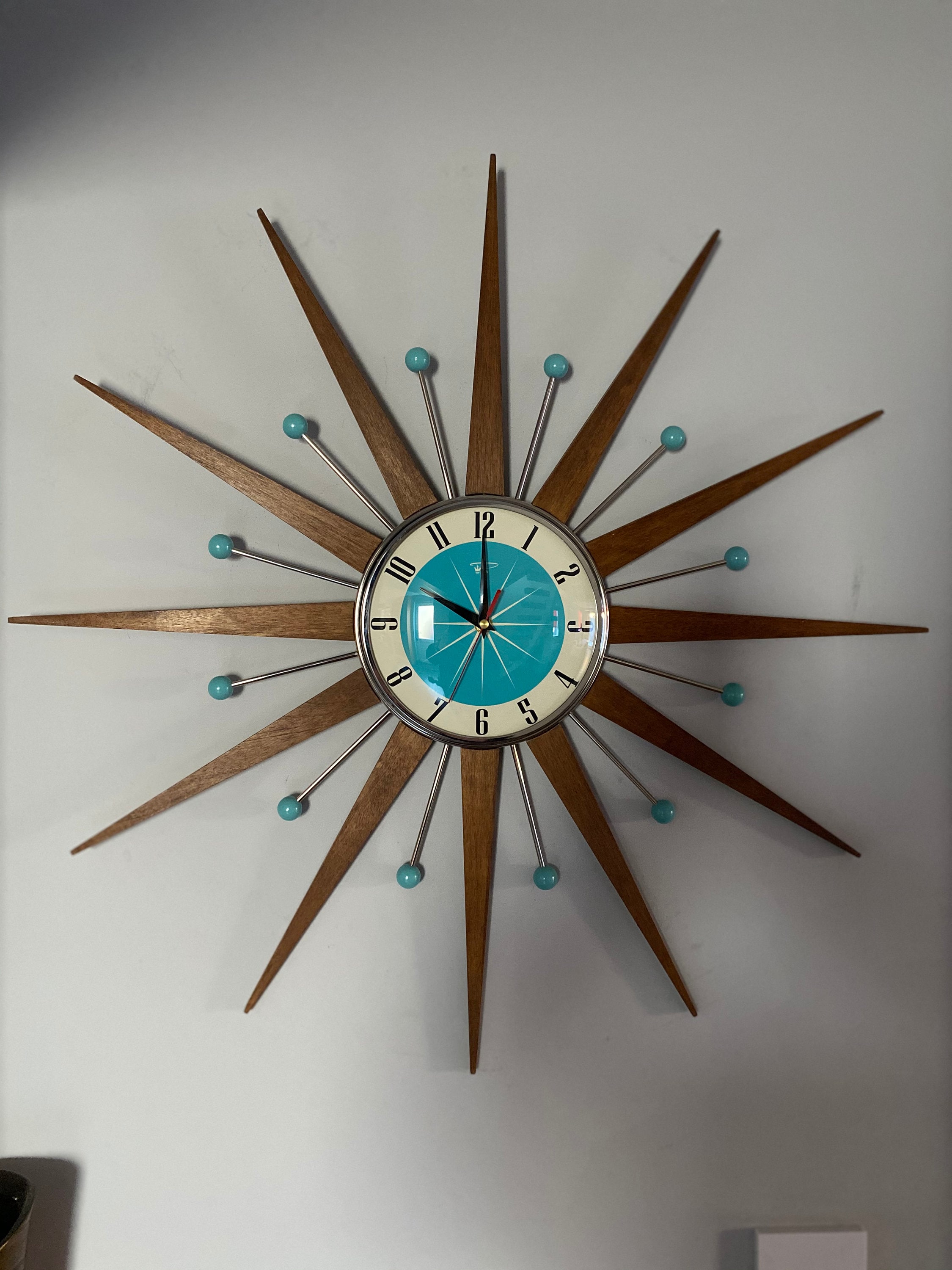 Top Selling Starburst Wall Clock by Royale Mid Century Modern style Chrome Silent Medium Teak Rays Turquoise Face Atomic Balls British Made