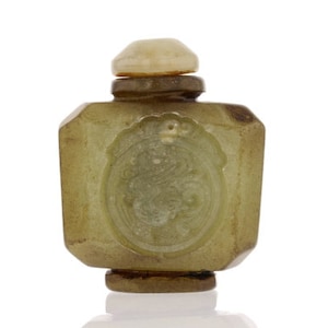 May include: A small, green jade bottle with a carved design. The bottle has a round, white stopper.